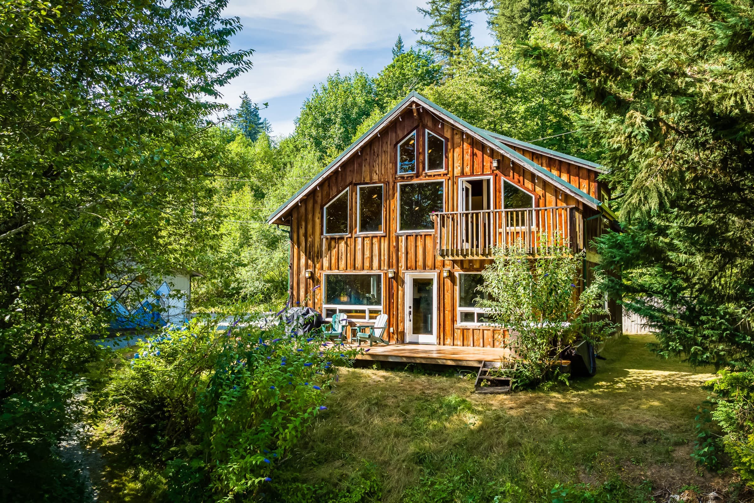 Cabin nestled in the woods along the Highway 2 corridor
