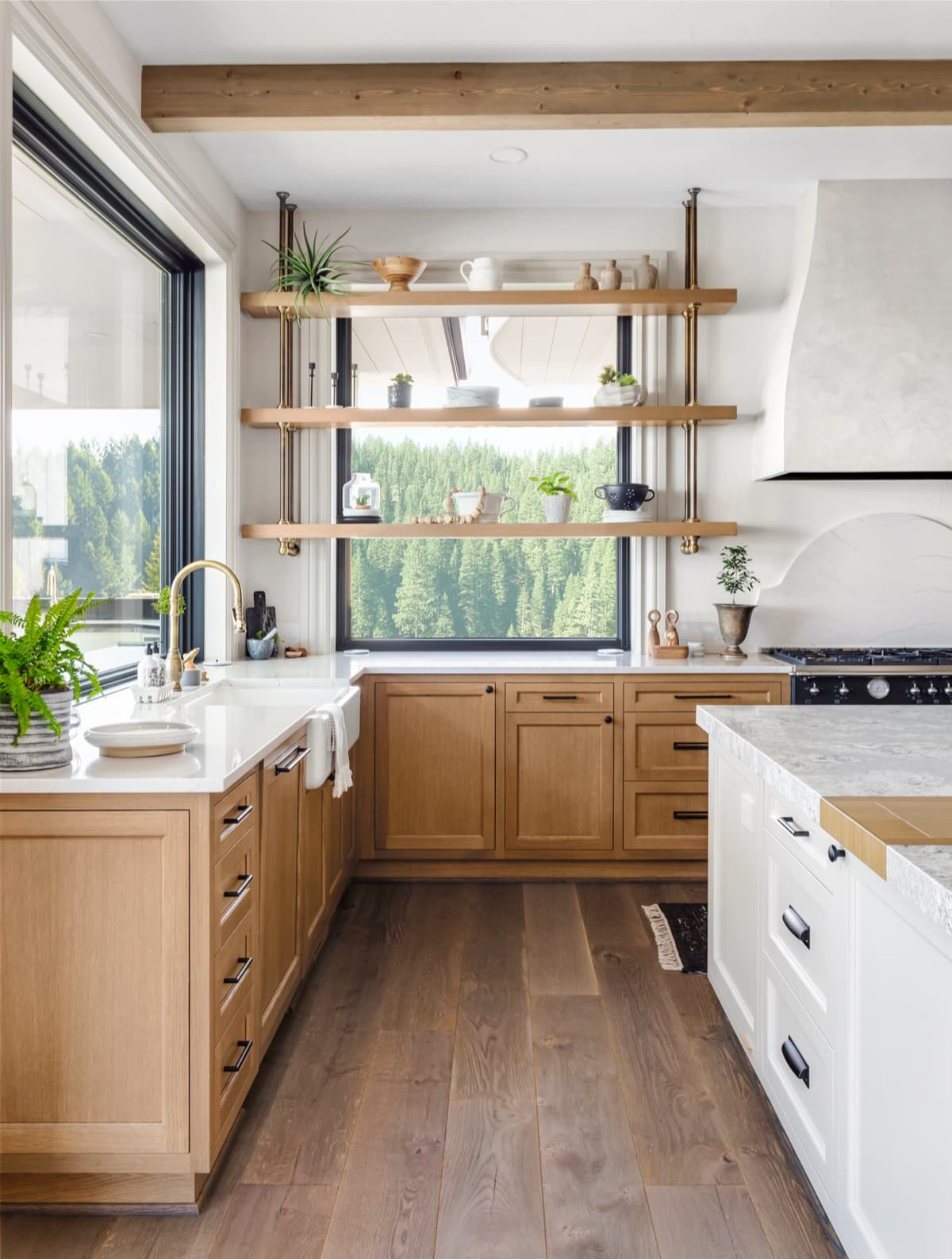 Kitchen with wood cabinets and forest views